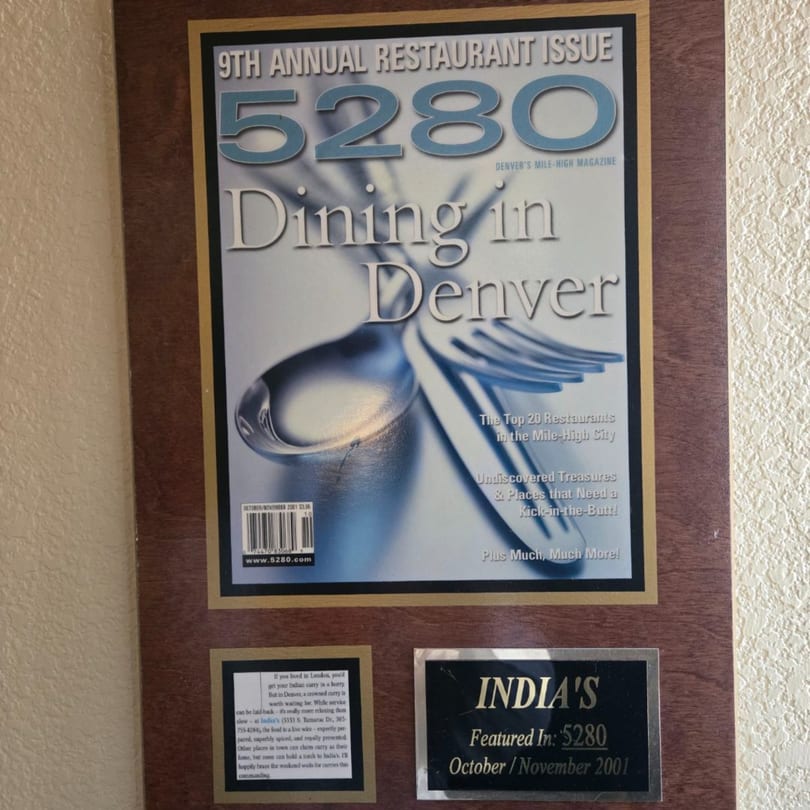 A framed 5280 magazine cover from 2001 featuring "Dining in Denver" and a plaque for INDIA'S Restaurant.